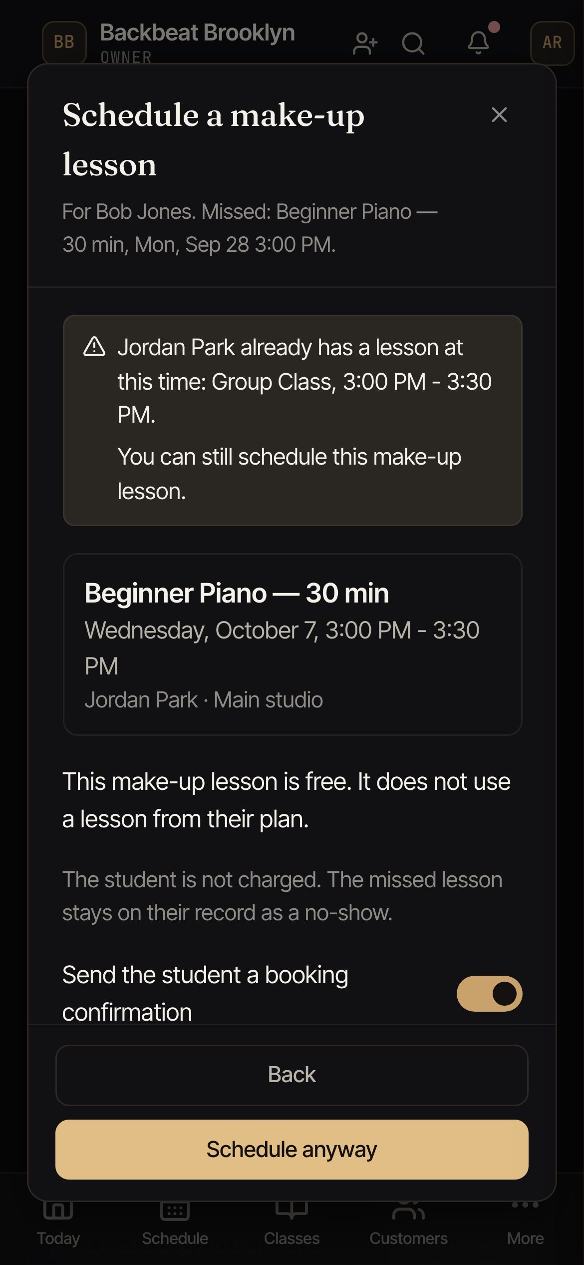 A warning saying the teacher already has a lesson at this time, with the Back and Schedule anyway buttons.